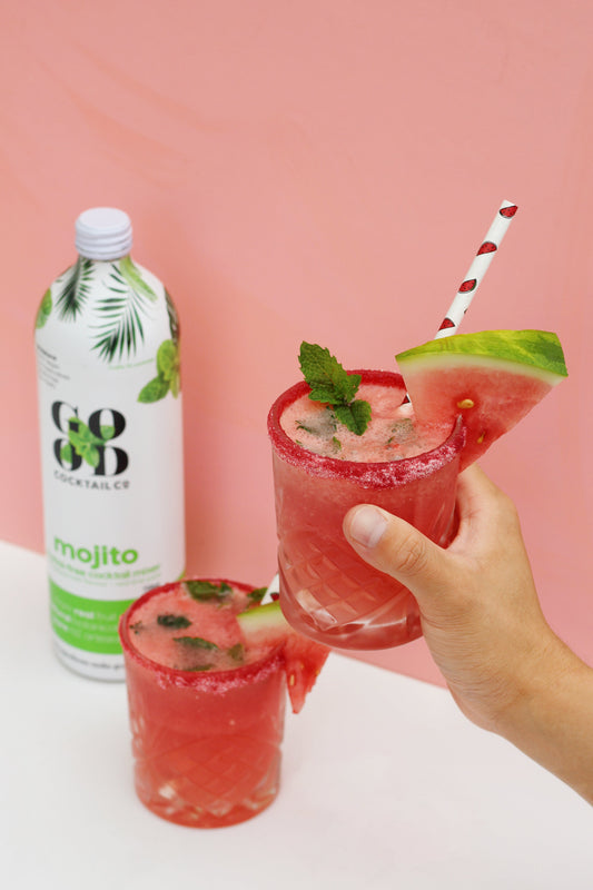 Image of two watermelon mocktail mojitos. Next to Good Cocktail co bottle in margarita flavour 