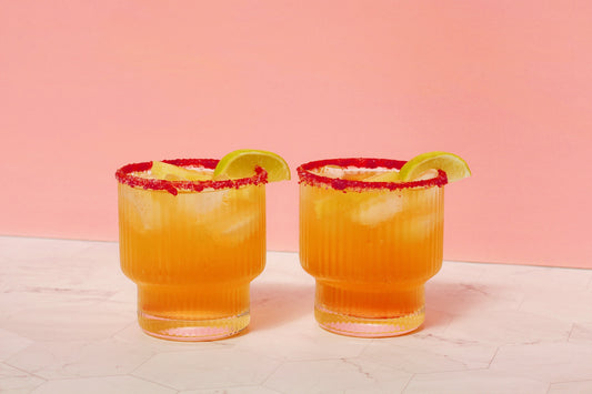Image of two mocktails in front of pink background