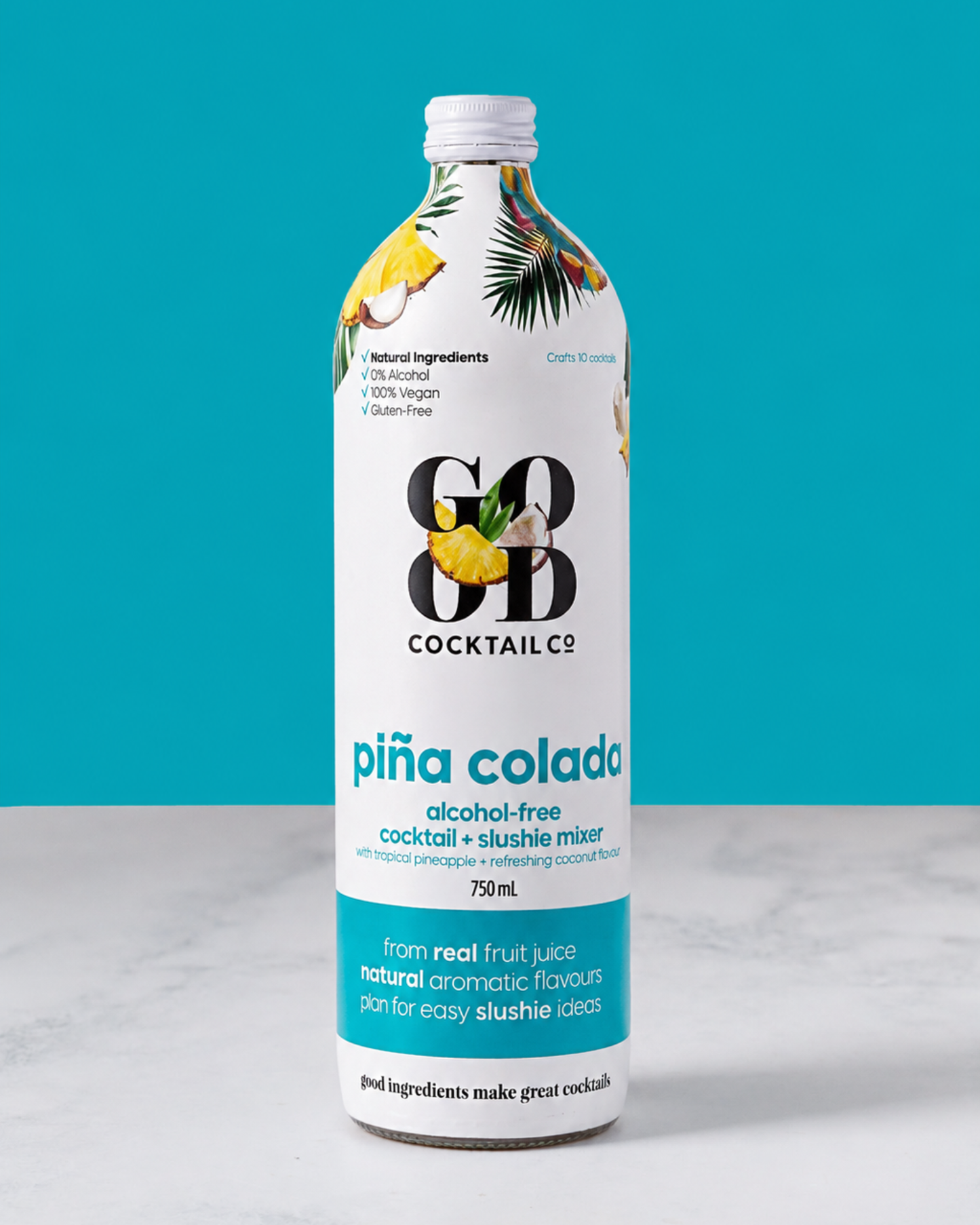 A 750 mL bottle of Cocktail Co. Piña Colado, an alcohol-free cocktail and slushie mixer, set against a bright teal background on a white surface.